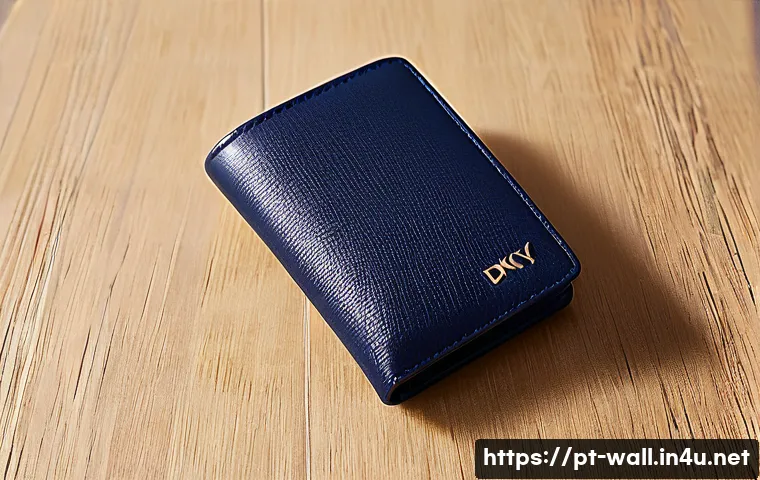 DKNY 모노그램 카드지갑 리뷰 - A close-up image of a sleek DKNY Monogram wallet made of high-quality synthetic leather, showcasing ...